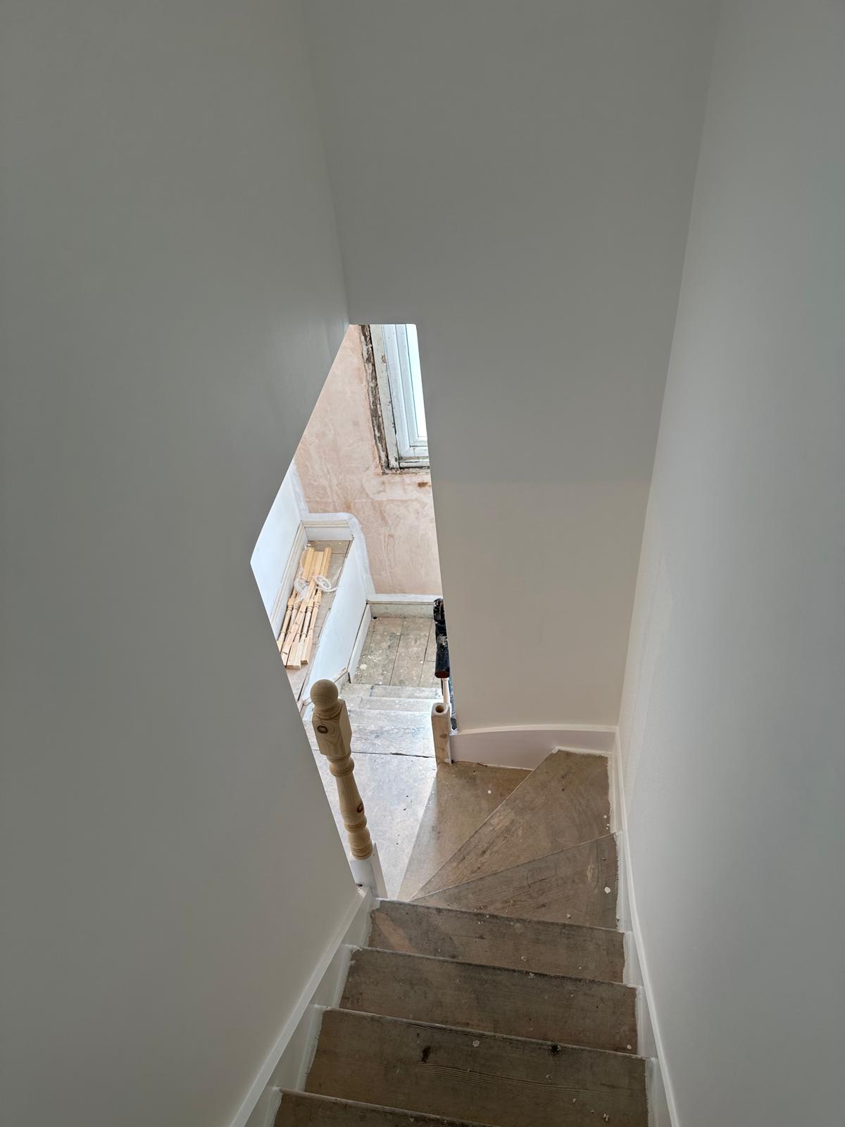 painter paints hallway in walthamstow